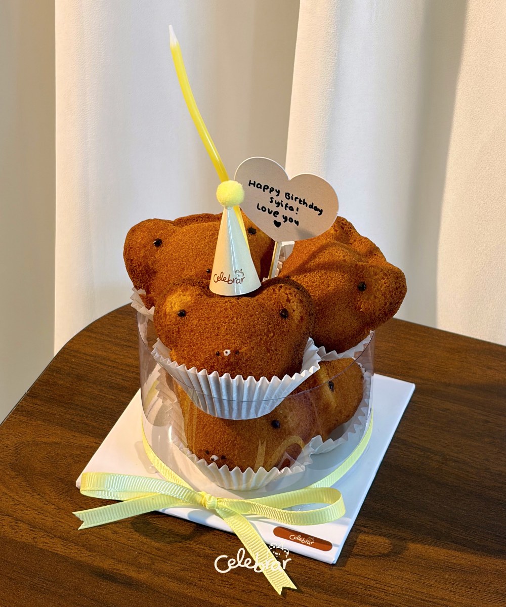 Teddy Stack gifted with a candle and a personalized heart tag