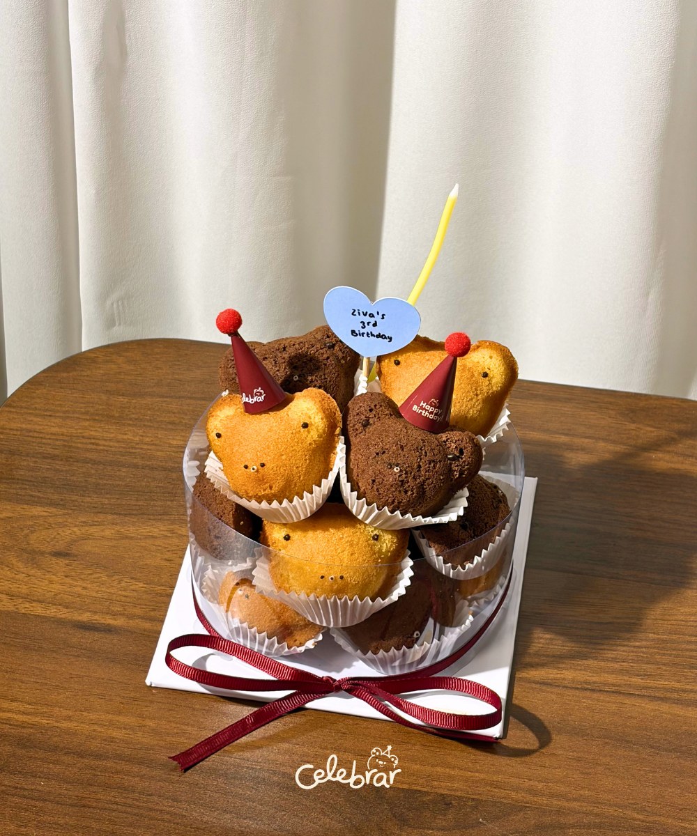 Teddy Stack for a 3rd birthday with red ribbon and hats